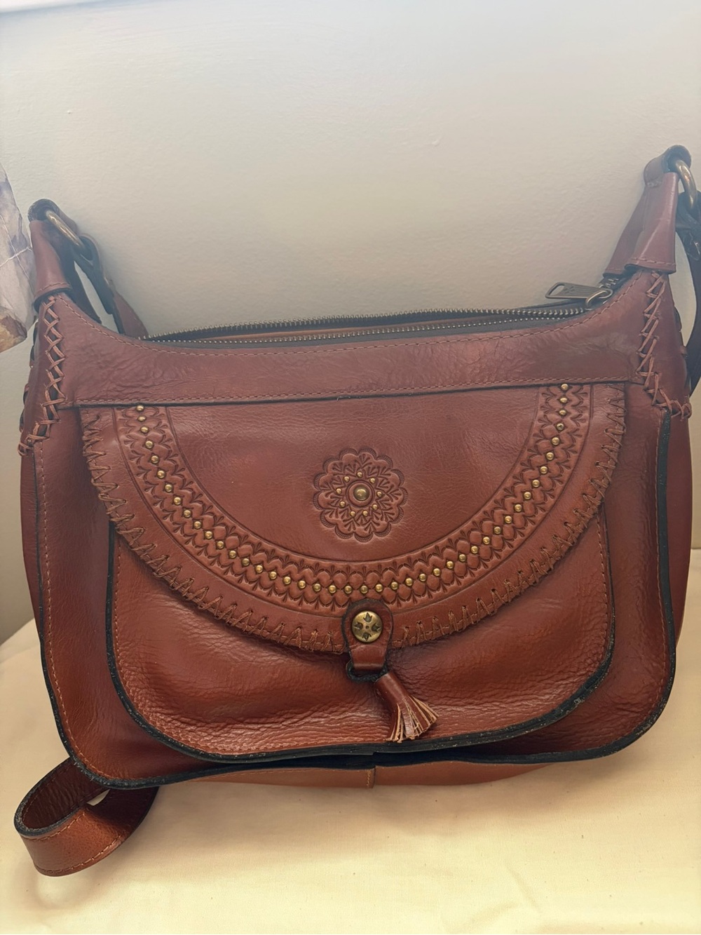 Patricia Nash Leather Hobo Crossbody Bag with Embossing and Tassel Accent